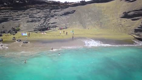 Beautiful-Green-Sand-Beach-on-the-Big-Island-in-Hawaii-at-the-most-southern-tip-in-the-United-States-shot-with-a-drone-in-slow-motion