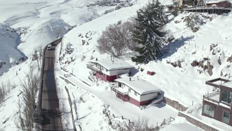 Farellones-Ski-Resort-Aerial-Drone-View,-Road-to-La-Parva-Snow-Travel-Andean-Cordillera-Landscape,-Santiago,-Chle