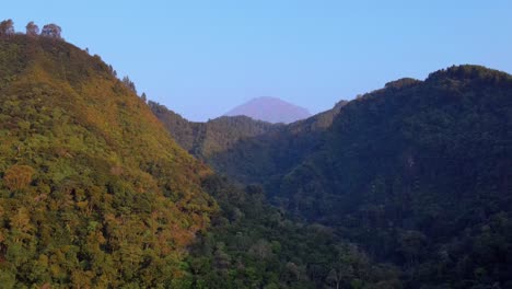 Distant-mountain-top-under-blue-sky,-scenic-view-of-untouched-wilderness