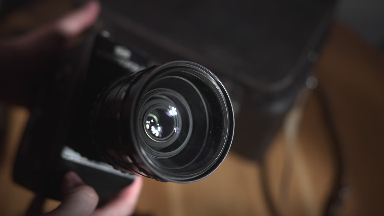 Hands Rotating Lens While Inspecting Glass And Focus, Adjusting Mount And Testing Optics, Closeup . Media
