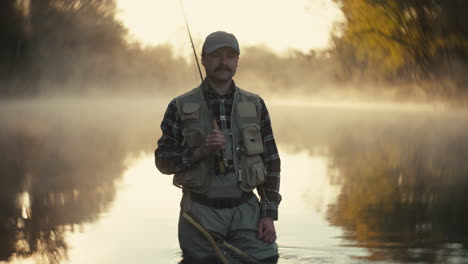 fisherman in a misty morning