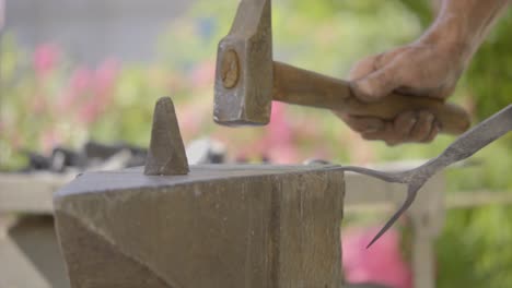 Slow-Motion-Shot-Of-Blacksmith-Working-On-Iron