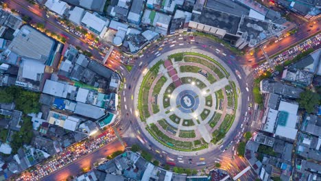 time lapse aerial view and top view of traffic on city streets in bangkok , thailand. expressway with car lots. beautiful roundabout road in the city center.