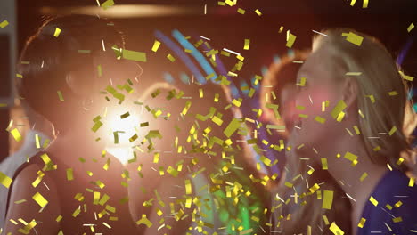 Celebrating-at-party-with-yellow-confetti-animation,-people-enjoying-moment