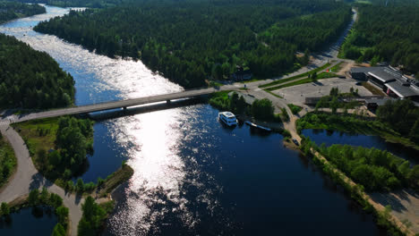 Aerial-view-of-a-large-cruise-boat-on-Lake-Inari,-sunny,-summer-day-in-Finland