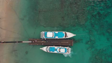 Topdown-shot-of-fast-ferry-on-Nusa-Penida-ready-for-departure,-aerial