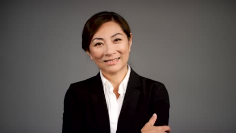 pull focus of approachable middle aged woman smiling portrait