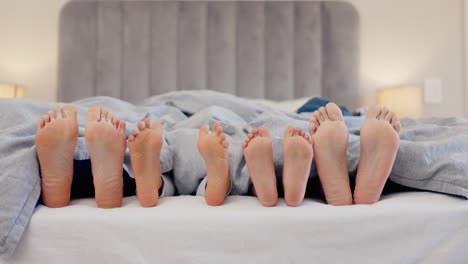 Sleeping,-feet-and-family-wake-up-in-a-bed