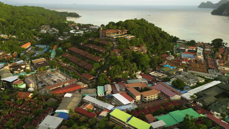 Drone-fly-around-main-Pier-Ton-Sai-on-Phi-Phi-Island-Thailand-travel-holiday-destination-aerial-view-of-traditional-thai-village