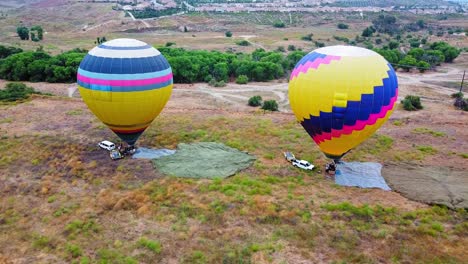 hot air balloons about to take flight. temecula, california - panoramic city view. misty morning. 14 sec.