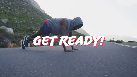 Animation-of-the-words-get-ready-in-white-over-man-exercising-on-mountain-road
