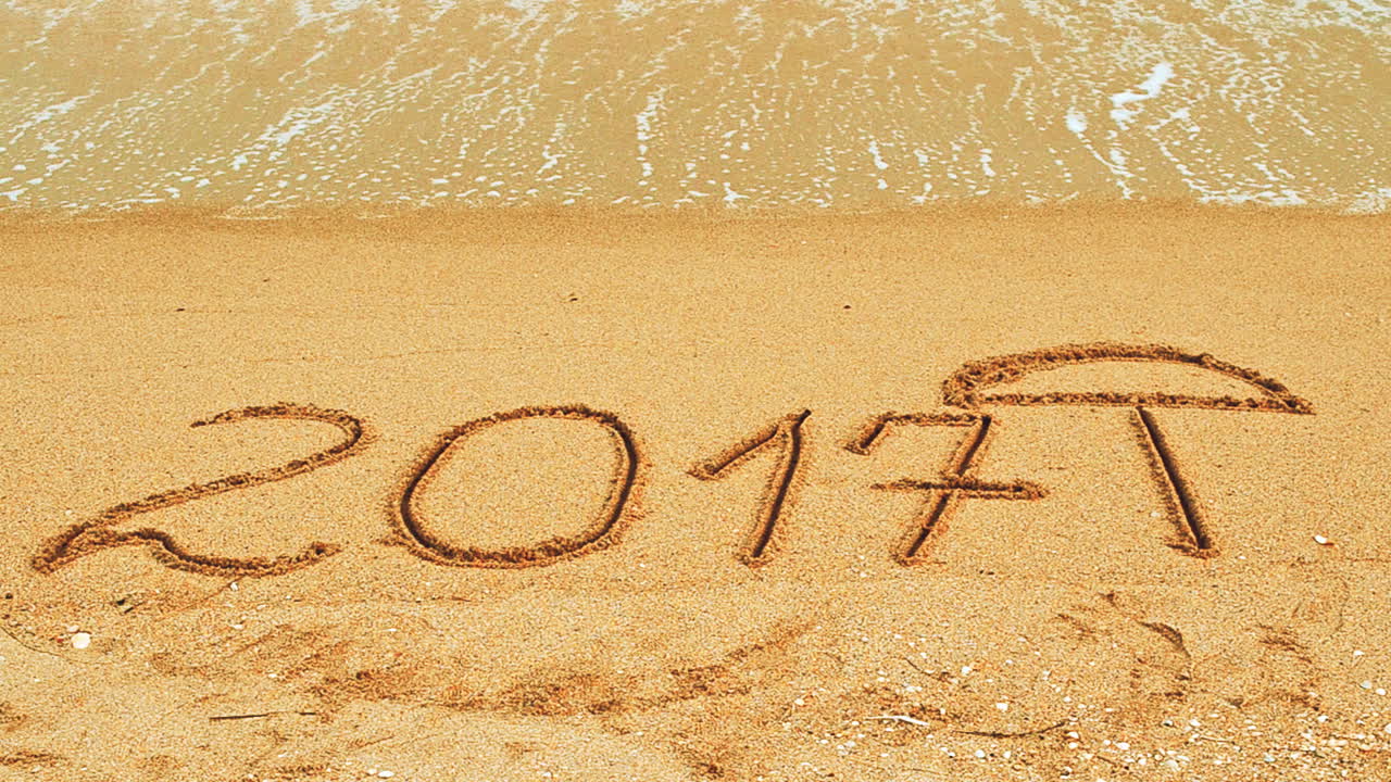 2017 in the form of an inscription on sand, the beach. Shooting on the beach