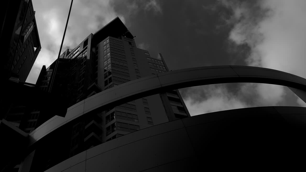 Futuristic modern skyscrapers. Architecture in black and white mood. Dolly shot