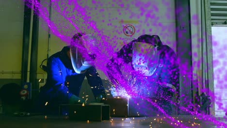 Animation-of-purple-glowing-mesh-over-male-engineers-welding