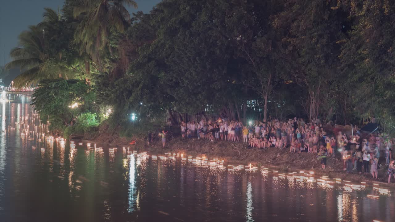 Riverbank Celebration at Night