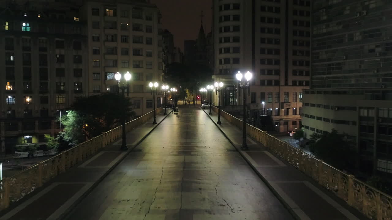Aerial view of Santa Efigenia viaduct at night with no one in the street, at night, Sao Paulo downtown, Brazil