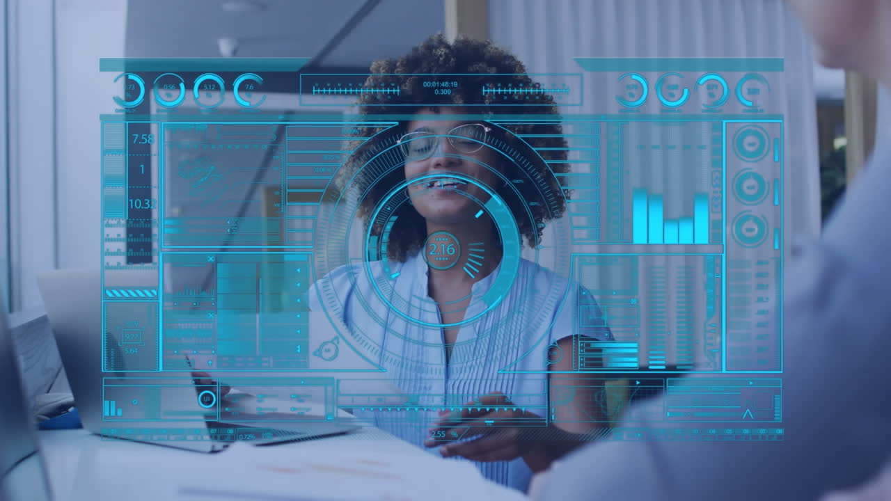 Animation of data processing on screen over african american businesswoman