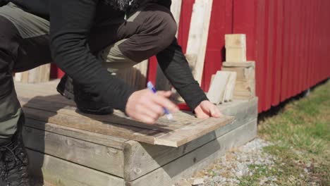 portrait of a man doing wood craft during sunny day