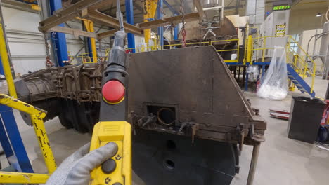 worker lifting plastic molds with a crane, manufacturing water tank process