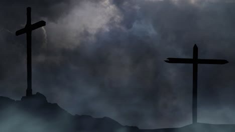 two-crosses-silhouetted-on-a-hill-with-dark-clouds-background