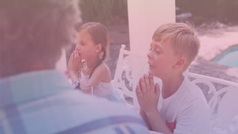 animation of caucasian family praying and having dinner