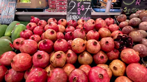 pomegranates arranged at a melbourne market stall