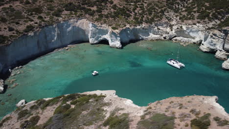 boat and sailboat in turquoise water