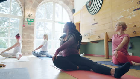 yoga class with women practicing poses
