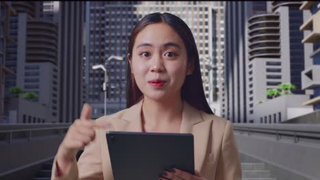 woman using tablet in a city setting