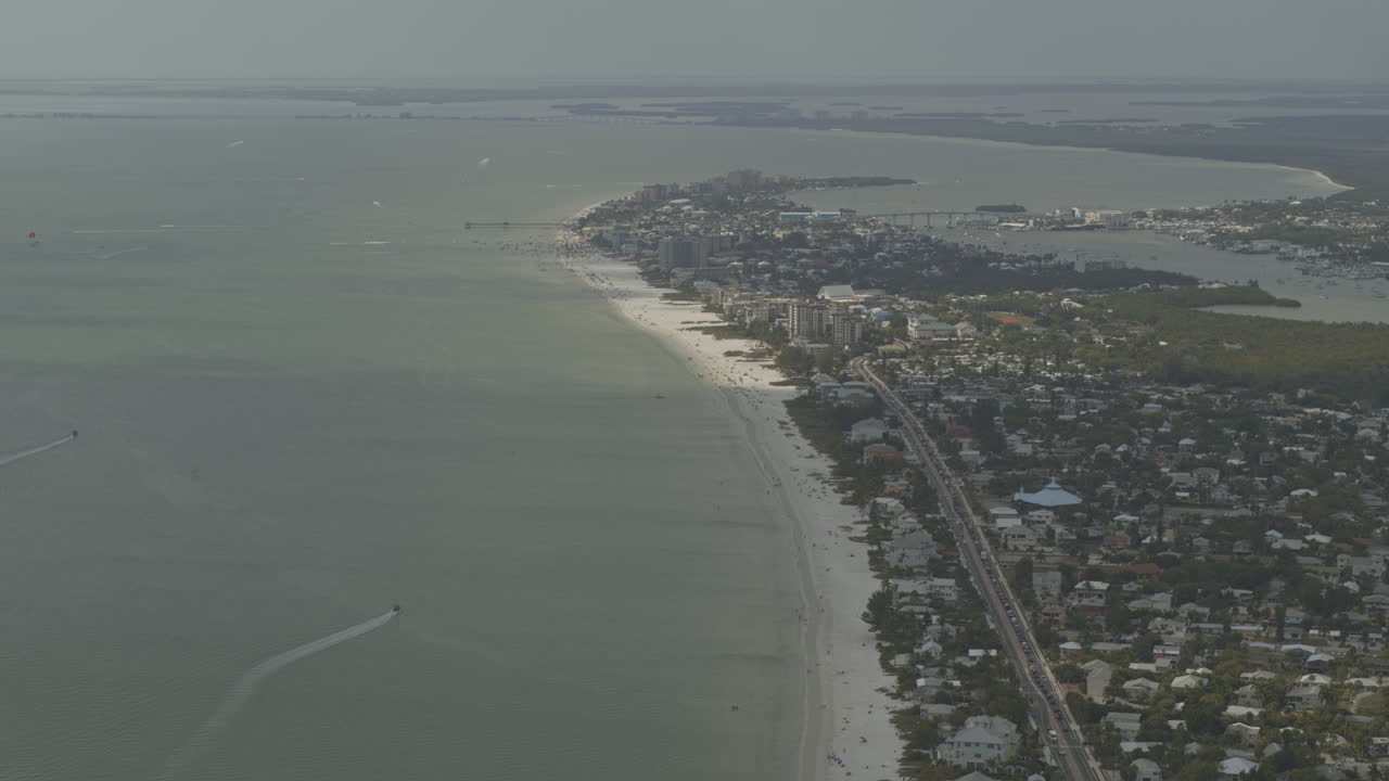 Fort Myers Beach Florida Aerial v5 tilt up reveal of the shoreline and downtown - DJI Inspire 2, X7, 6k - March 2020