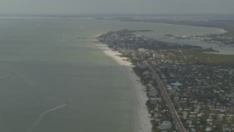 Fort Myers Beach Florida Aerial v5 tilt up reveal of the shoreline and downtown - DJI Inspire 2, X7, 6k - March 2020