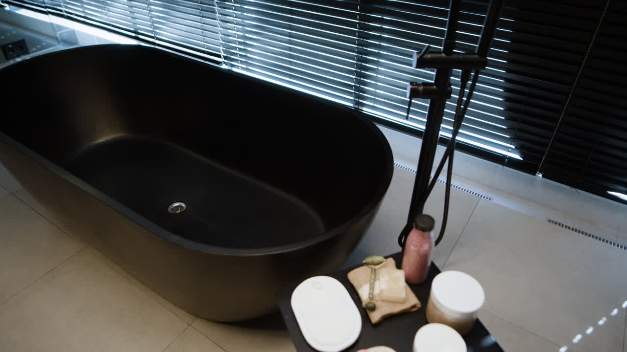 Modern Black Bathtub in a Luxurious Spa-Inspired Bathroom