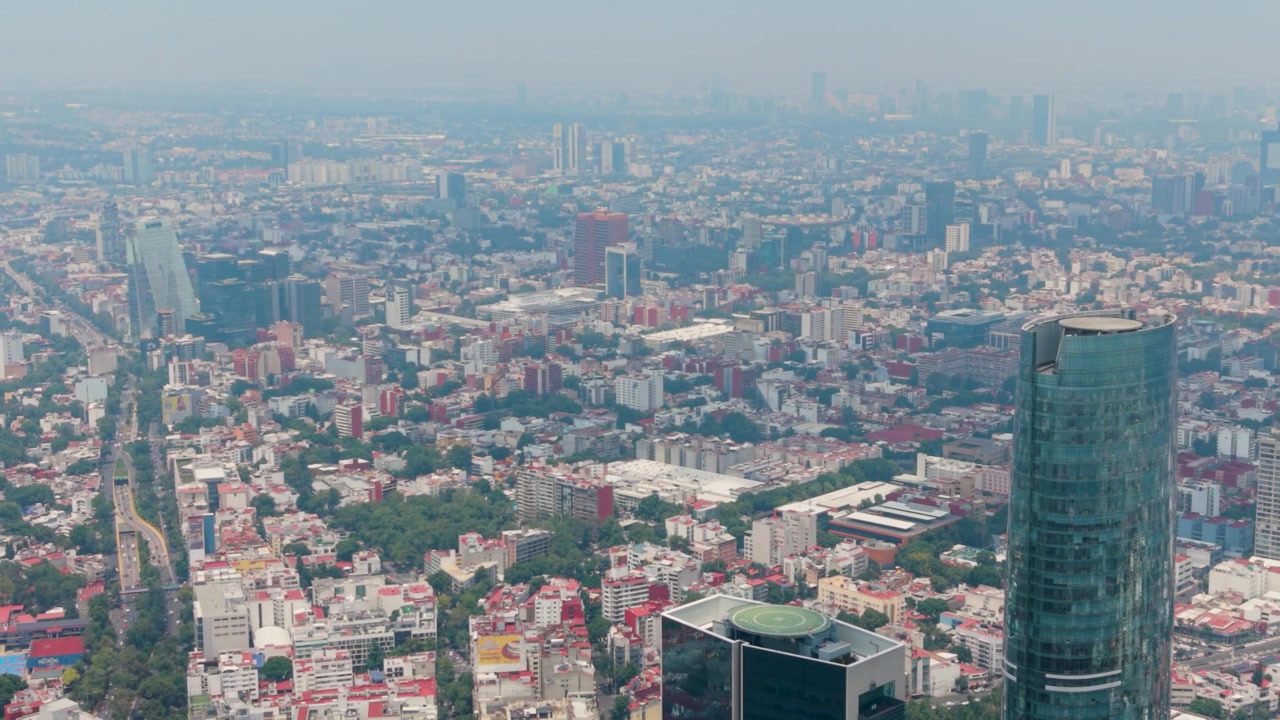 Elevated cityscape with Mítikah Tower on the right, CDMX
