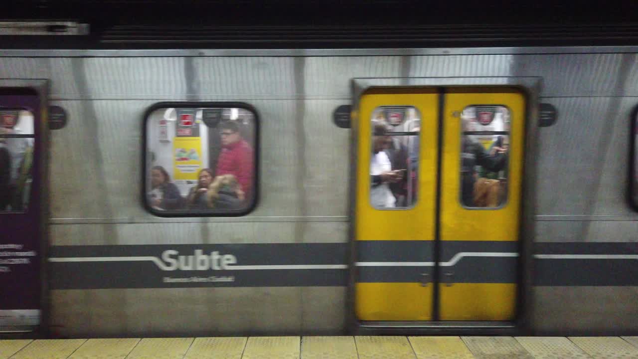 Subway train arriving to underground railway station of south american city platform
