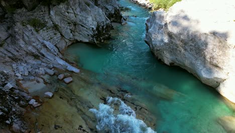 the soča river in slovenia, part of the triglav national park, has an emerald green color, and is one of the most beautiful rivers in all of europe