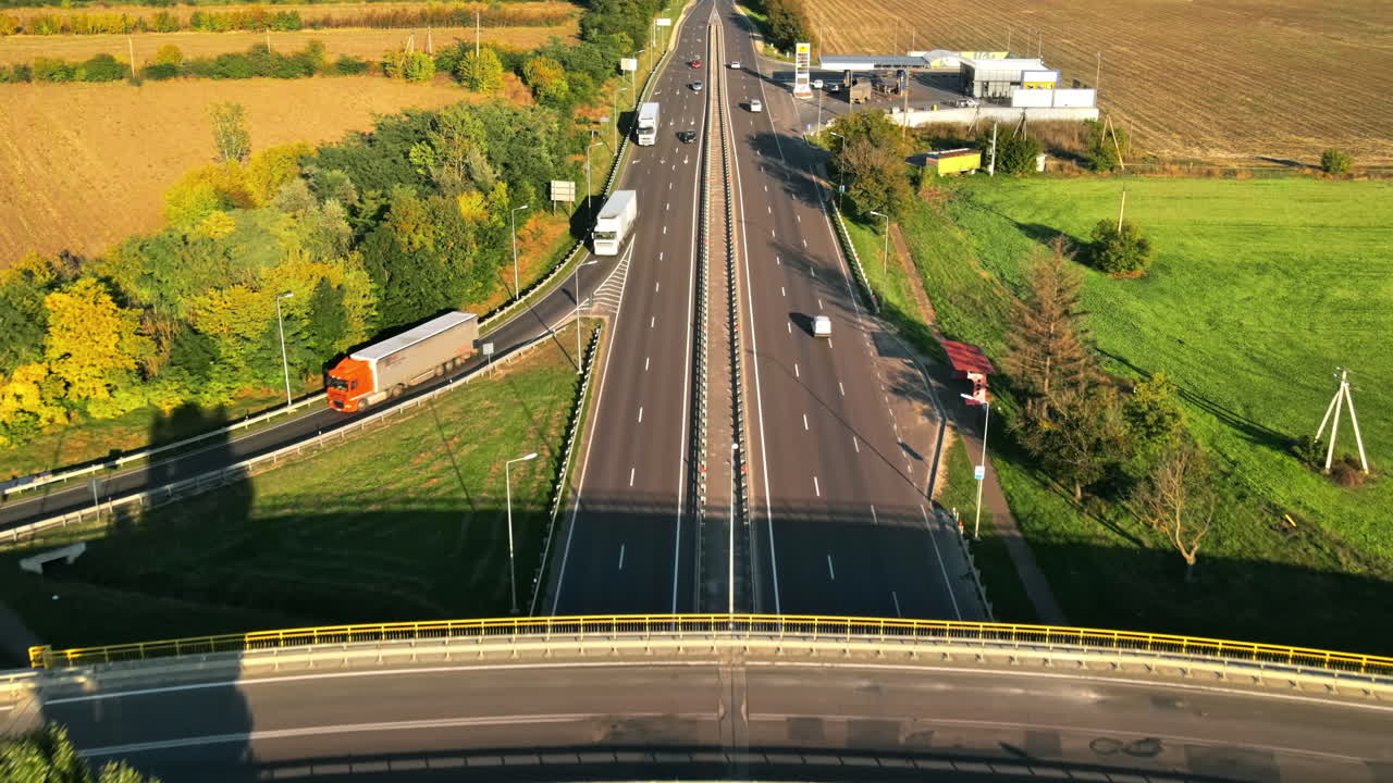 CHISINAU, MOLDOVA - AUGUST 25, 2021: Aerial drone view of a road junction with moving cars and nature, greenery, fields, Moldova