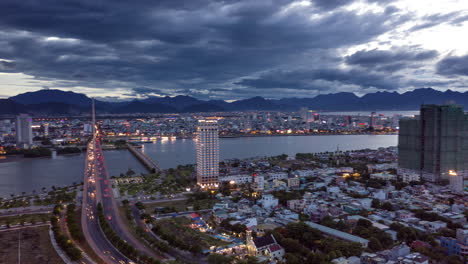 Aerial-Urban-Hyperlapse-of-Modern-Cityscape-at-Rush-Hour-Traffic-with-Car-lights-over-Bridge-at-Evening