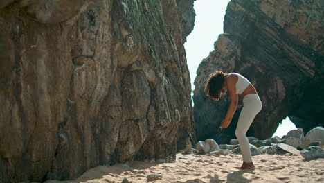 yogi girl standing feet after headstanding outdoors. woman practicing yoga.