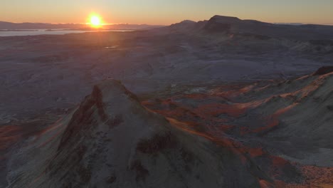 Flying-above-mountainous-moorland-scenery-in-winter-at-sunrise