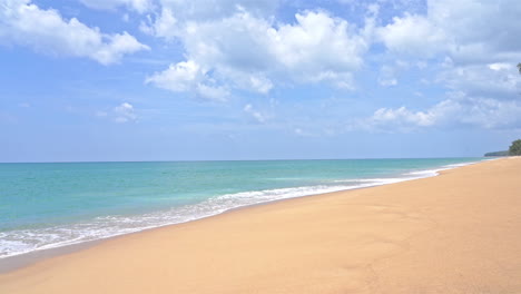 empty island white sand beach and emerald tranquil sea tides, cloudy sky, vacation template, copy space minimalistic