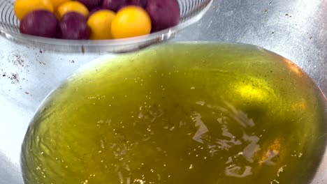 colorful balls being deep-fried in hot oil