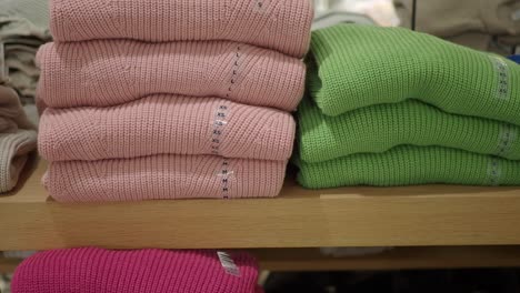 stacked sweaters on display