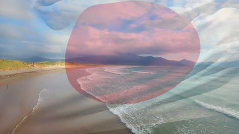 composición digital de la bandera de japón ondeando contra la vista aérea de las olas en el mar