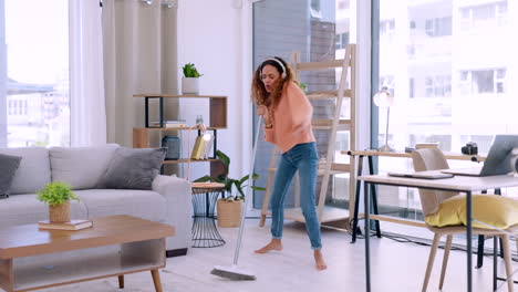 Woman,-dancing-and-cleaning-living-room