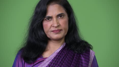 close up shot of mature beautiful indian woman wearing sari traditional clothes
