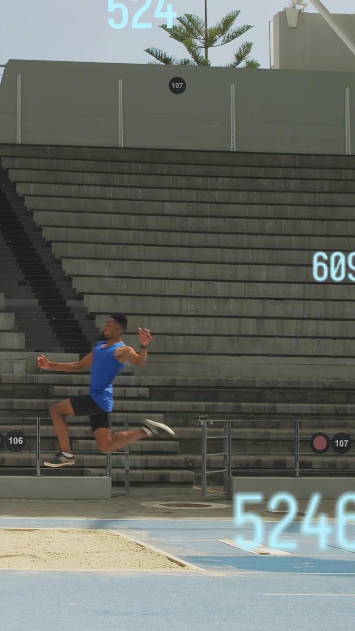Vertical video: Man entering sprinting track hitting board leaping while AR nums measuring distance