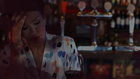animation of black clouds over sad caucasian woman with red wine