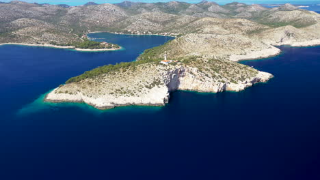 lighthouse cape struga at the southern island of lastovo, croatia. - aerial drone, wide shot