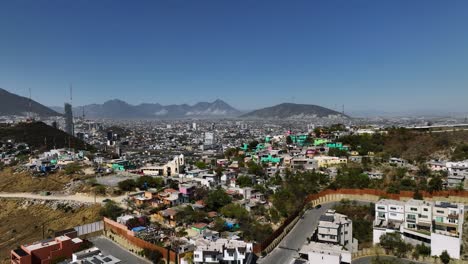 Contrast-between-the-rich-and-poor-in-the-hills-of-Monterrey,-Mexico---aerial-view