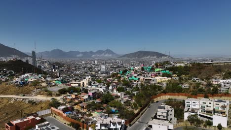 contrast between the rich and poor in the hills of monterrey, mexico - aerial view